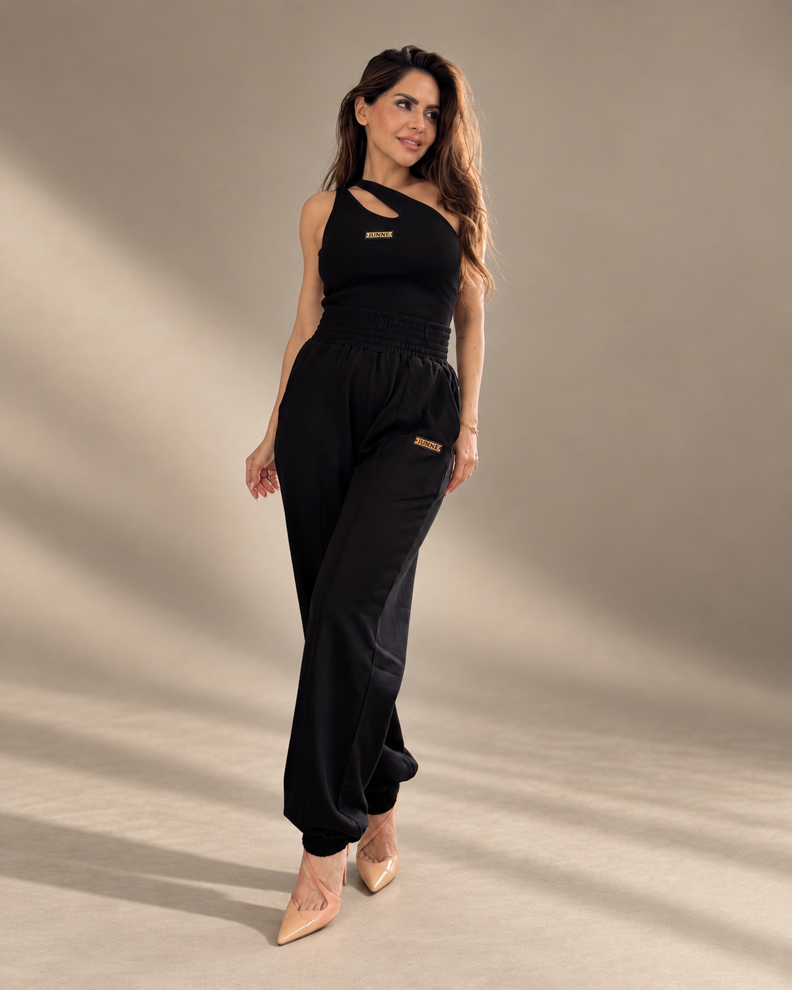 JUNNE Midnight Duo Co-ord Set — full-length angled view of the black Kylie Top and Mila Joggers